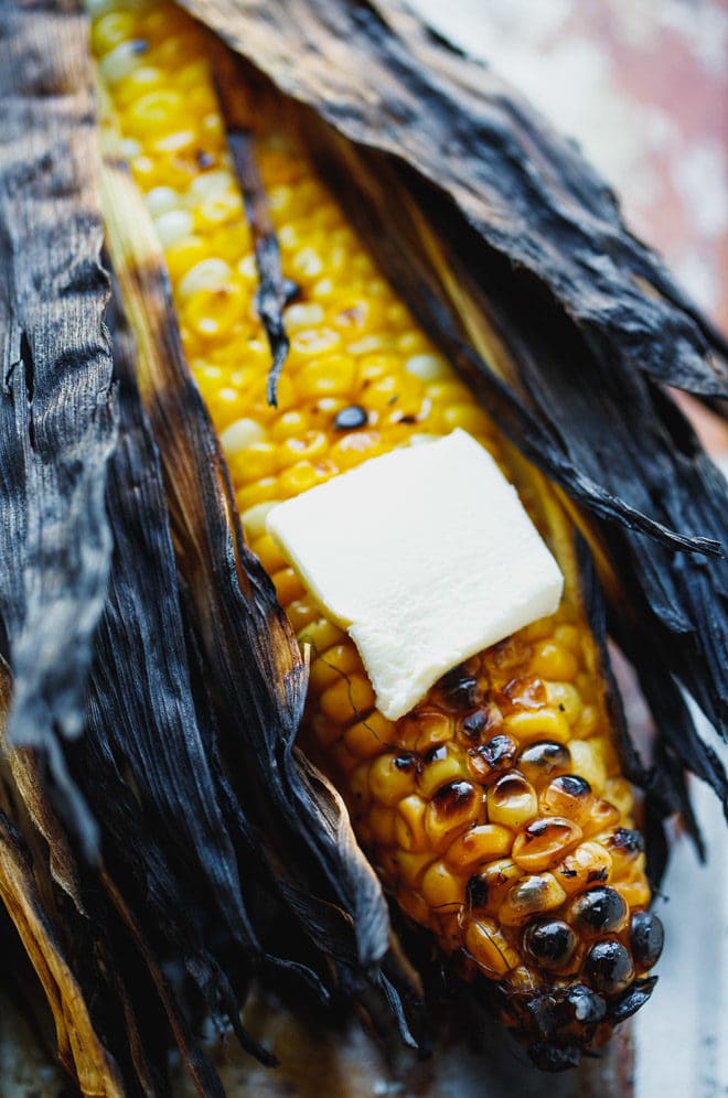 Grilled corn on the cob topped with butter