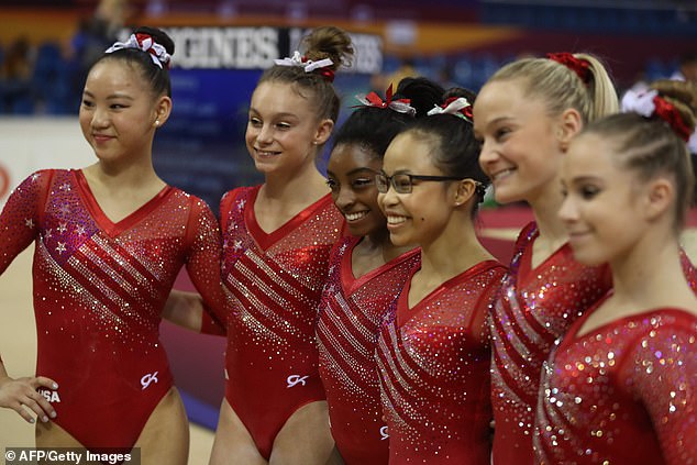 Victory: Simone Biles led Team USA to victory on Tuesday at the world championships in Doha