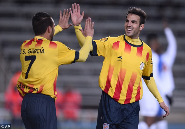 Strike: Sergio Garcia (left) celebrates scoring for Catalonia against Cape Verde with Cesc Fabregas