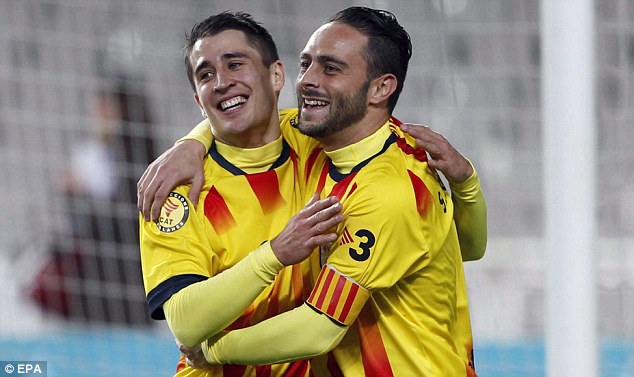 Amigo: Bojan (left) congratulates Sergio Garcia after the Spaniard scored against Cape Verde
