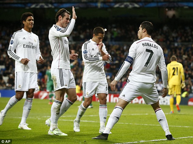 Gareth Bale (second from left) goes to congratulate Ronaldo as Real sealed their 19th consecutive win