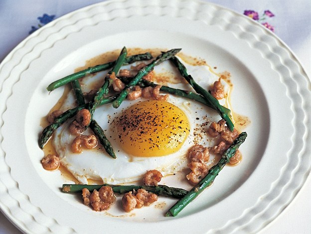 Fried duck egg with potted brown shrimps and British asparagus