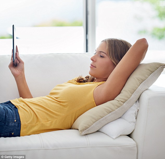 The average adult in the UK spends between 55 and 70 per cent of their day in a sedentary position - that¿s around 13 hours, not including sleeping (stock photo)