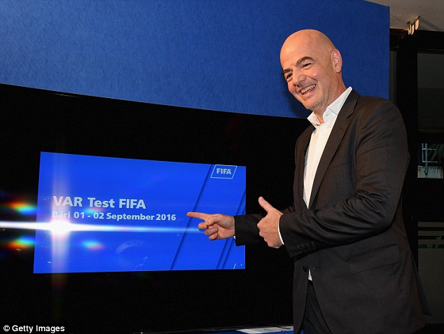 FIFA president Gianni Infantino shows off the new video assistant referee trial