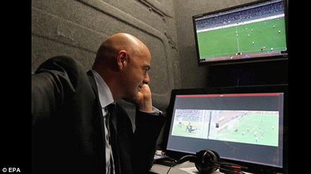 Infantino looks over replays of Italy