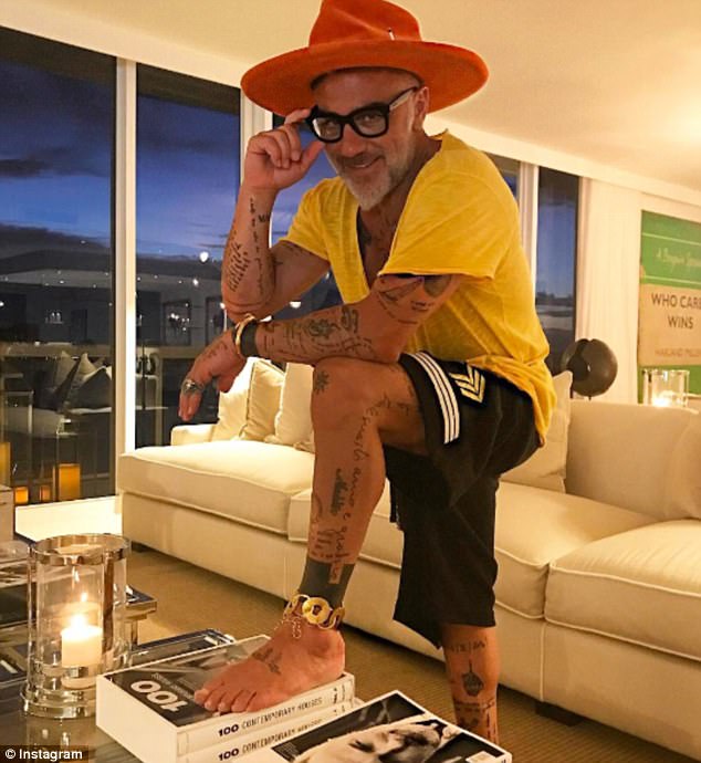 Showcasing his buff physique, which is scattered with tattoos, the 49-year-old likes nothing better than showing off his flamboyant wardrobe in snaps taken on holidays