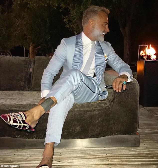 Vacchi enjoying dinner with friends. Gianluca - who heads up the manufacturing company SEA Società Europea Autocaravan - has an estimated net worth of 300 million dollars