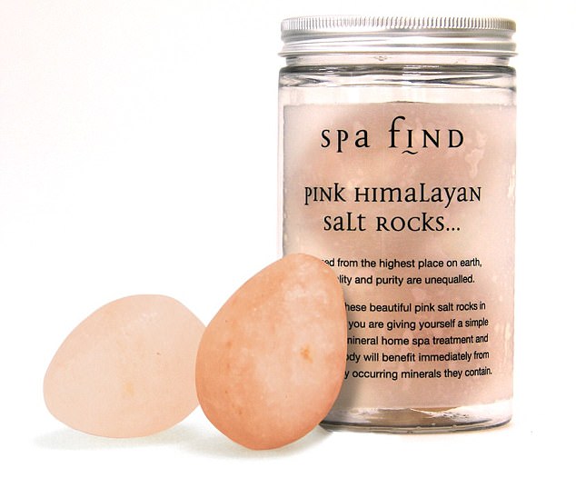 These two smooth pebbles of Himalayan salt can be used as massage tools, or placed in a warm bath
