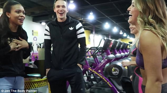 Stunned: The gym employee (left) who showed the trio around didn