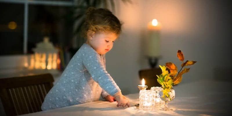 little girl at empty family table