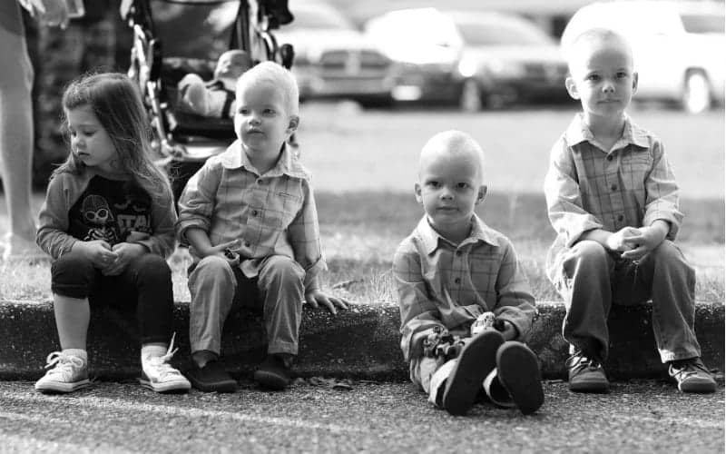 four young children sitting