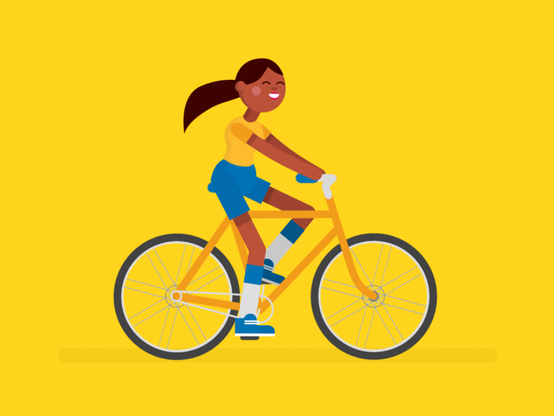 девушка едет на велосипеде в хорошем настроении