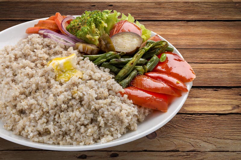 Barley porridge with vegetables. stock photography