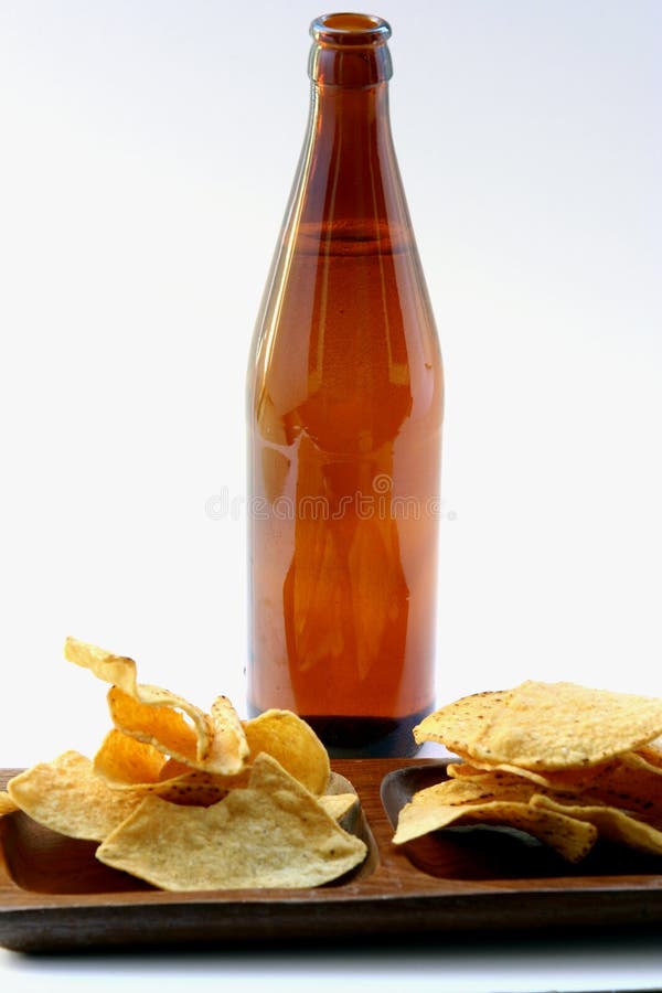 Beer Bottle with Unhealthy Eating. Beer Bottle and Unhealthy Eating isolated royalty free stock photography