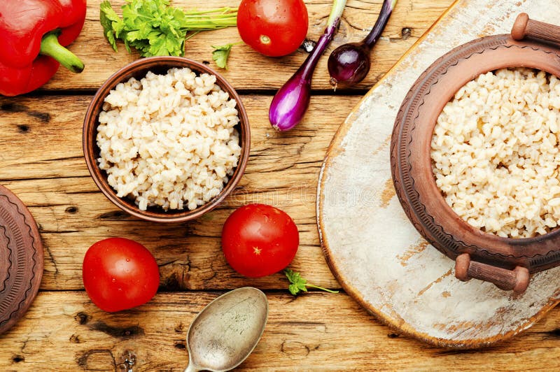 Boiled pearl barley on plate royalty free stock photography