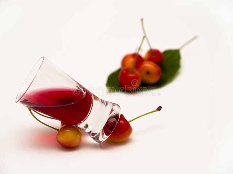 Cherry liqueur. Tincture cherry on a white background royalty free stock photos