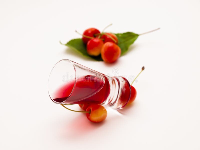 Cherry liqueur. Tincture cherry on a white background stock image