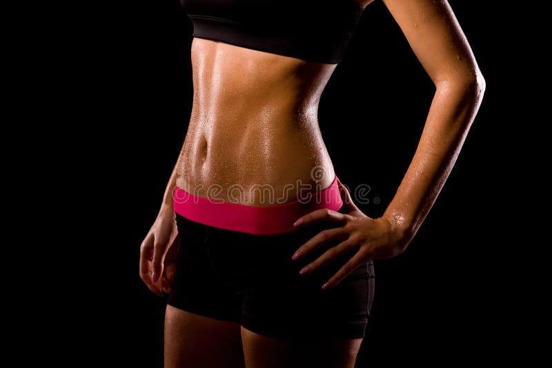 Fitness sweating woman on black background. stock photos