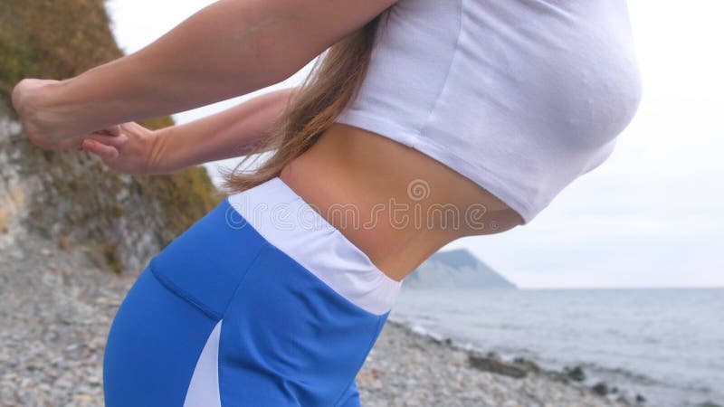 Flat belly girl during breathing exercises bodyflex. Belly close-up view. Flat belly girl during breathing exercises body flex stock images