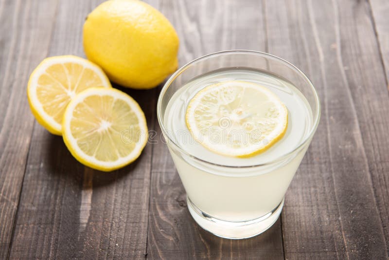 Freshly squeezed lemon juice in glass. stock photos