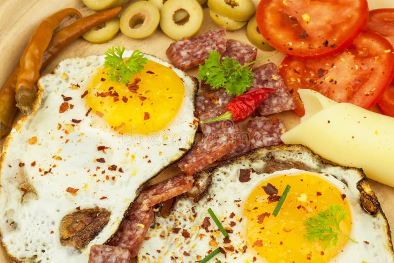 Fried Eggs on a plate. A hearty breakfast for athletes. Healthy food. Fried Eggs on a plate. A hearty breakfast for athletes. Healthy food royalty free stock image