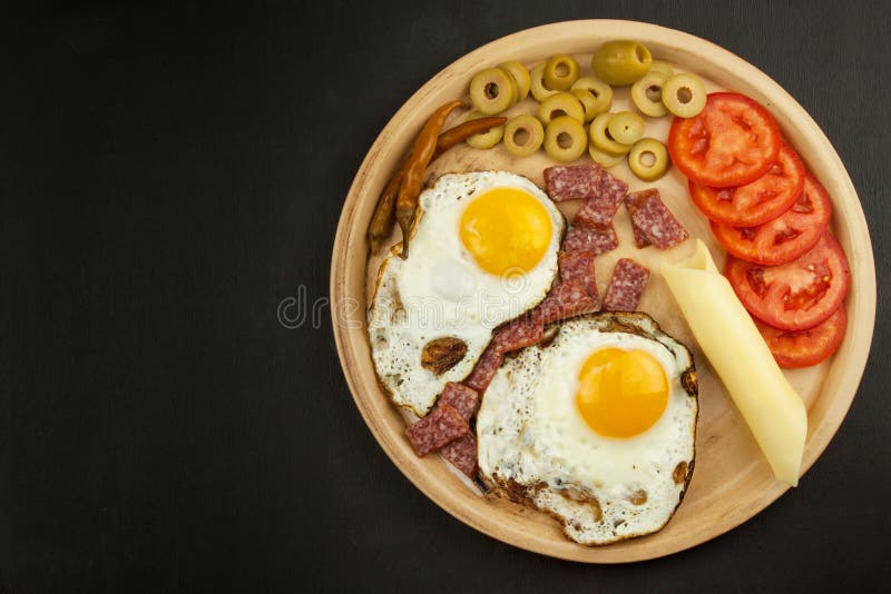 Fried Eggs on a plate. A hearty breakfast for athletes. Healthy food. Fried Eggs on a plate. A hearty breakfast for athletes. Healthy food stock images