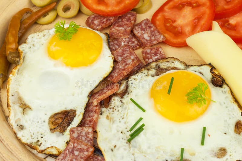 Fried Eggs on a plate. A hearty breakfast for athletes. Healthy food. Fried Eggs on a plate. A hearty breakfast for athletes. Healthy food stock photos