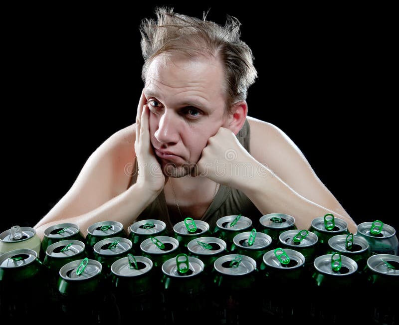 Hangover. Unhealthy man and beer cans. Portrait stock photography