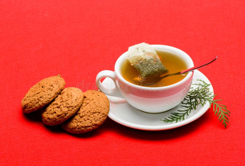 Health care folk remedies. Cafe restaurant menu. Cup of tea on red background close up. Herbal or green tea. Ceramic cup stock photography