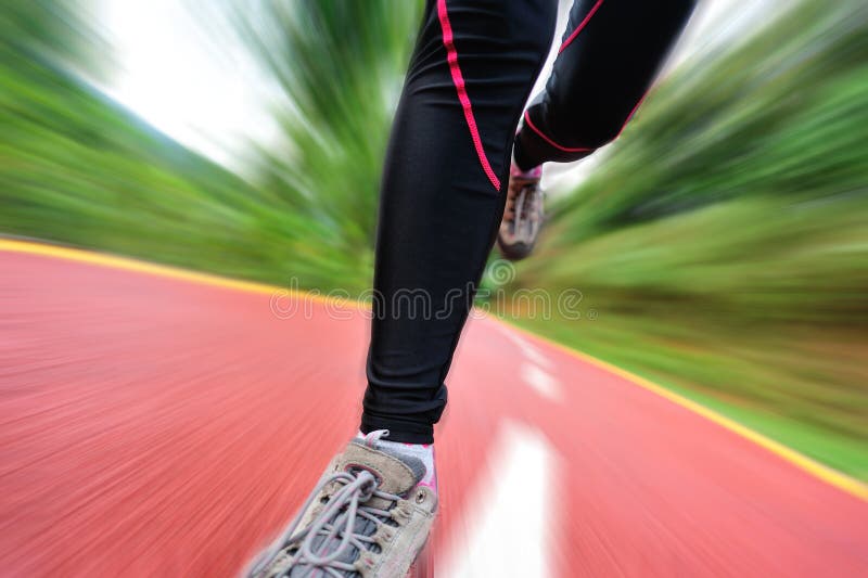 Healthy lifestyle fitness sports woman legs runnin. G at park trail royalty free stock image
