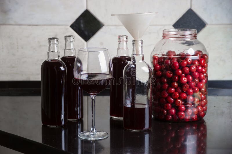 Homemade tincture of cherry. The concept of home-made drinks royalty free stock image