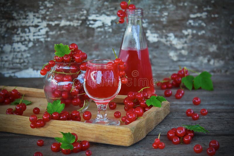 Liqueur of red currant in the glass stock photography