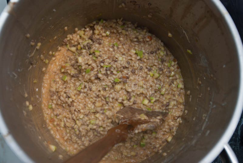 Pearl Porridge in a Saucepan, Close up, in Metallic Saucepan with wooden Spoon. Top view. royalty free stock photos