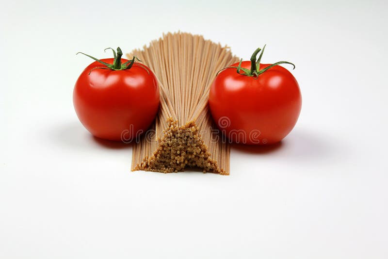 Raw Pasta and tomatoes stock images