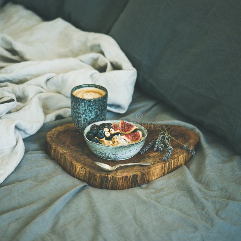 Rice coconut porridge and espresso in bed, square crop stock images