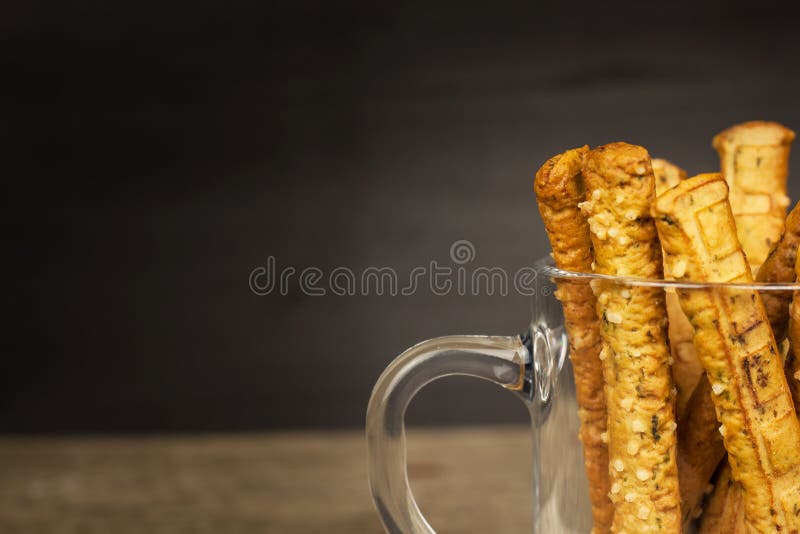 Salt sticks in a glass. Snack party. Unhealthy pastry for beer. Salt sticks in a glass. Snack party. Unhealthy pastry for beer stock photography
