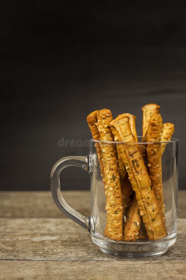 Salt sticks in a glass. Snack party. Unhealthy pastry for beer. Salt sticks in a glass. Snack party. Unhealthy pastry for beer stock images