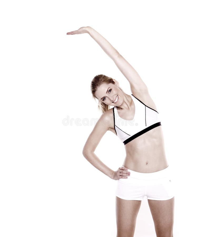 Stretching exercise. Beautiful blond woman doing stretching exercise royalty free stock photography