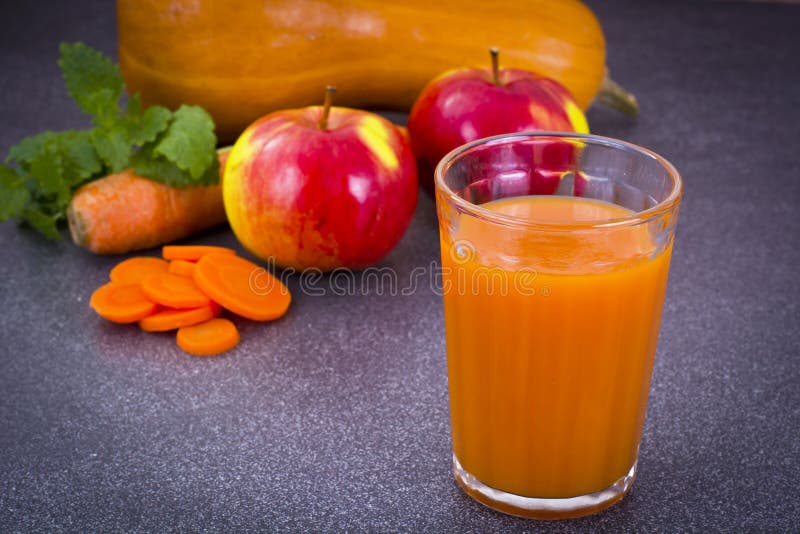 Sweet Tasty Vitamin Carrot, Pumpkin, Apple Juice. Studio Photo royalty free stock images