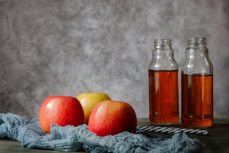 On the table is apple juice in a glass bottle royalty free stock images