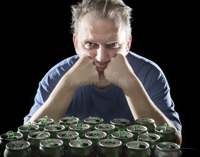 Unhealthy view man after drunk, near empty beer container. Portrait royalty free stock image