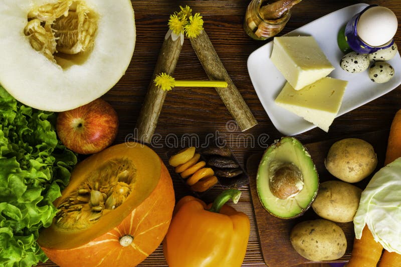 Vitamin A in food, Natural products rich in vitamin A as pepper, carrot, pumpkin, apple, potato, cabbage, avocado,dried apricots,. Melon, anchovy, yellow cheese stock photos
