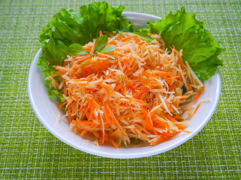 Vitamin salad with apple, carrot and celery root. Vitamin salad with apple, carrot and celery root royalty free stock image
