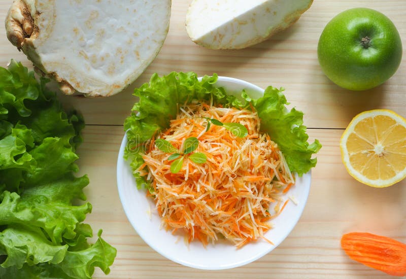 Vitamin salad with apple, carrot and celery root. Vitamin salad with apple, carrot and celery root stock images