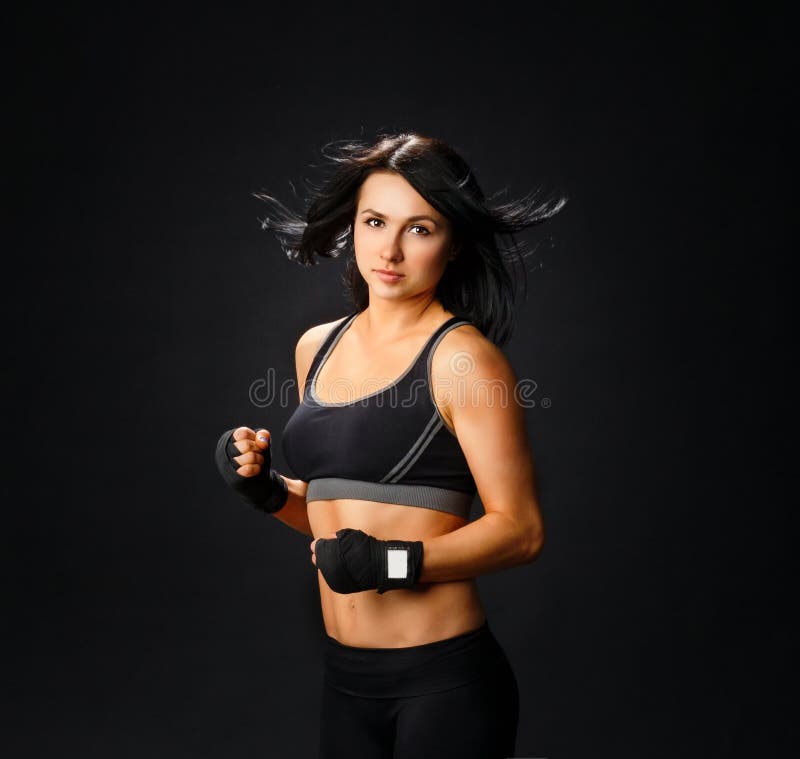 Young fitness woman in gym gloves royalty free stock images