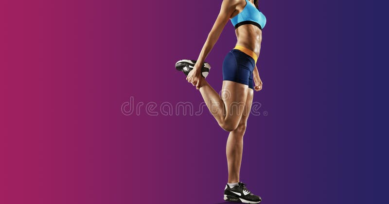 Young fitness woman stretching legs. Isolated royalty free stock photography