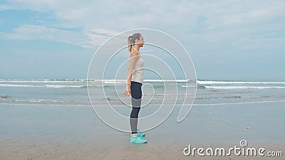 Young woman doing sit-ups in the morning in the bedroom. The girl does morning exercises stock video footage