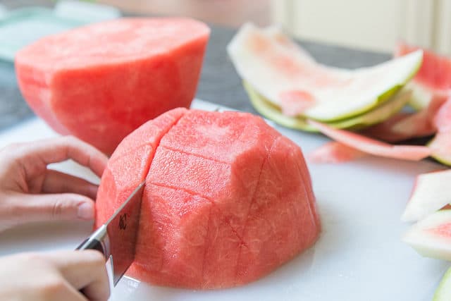 How to Cut Watermelon Sticks - Straight Down on Cutting Board