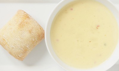 Bowl of creamy parsnip soup with crusty bread