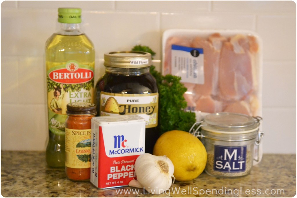 Assemble the ingredients for this easy chicken recipe: olive oil, chicken, honey, lemon, garlic and seasoning.